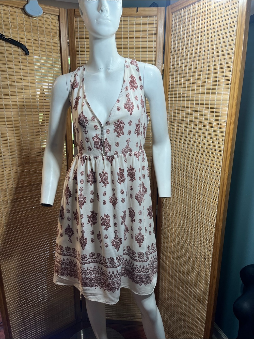 NWT! Beyond The Radar
Sleeveless V-Neck Mini Dress in Cream with Burgundy Print